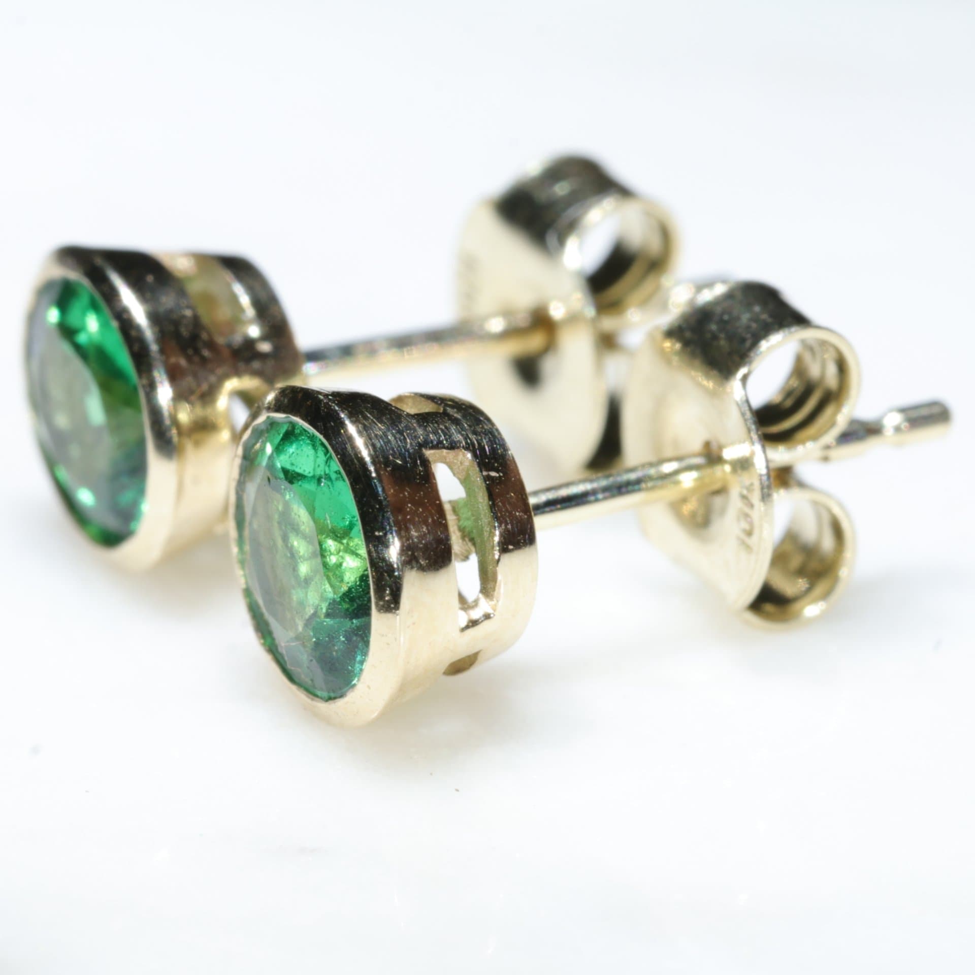 Green stone on sale stud earrings