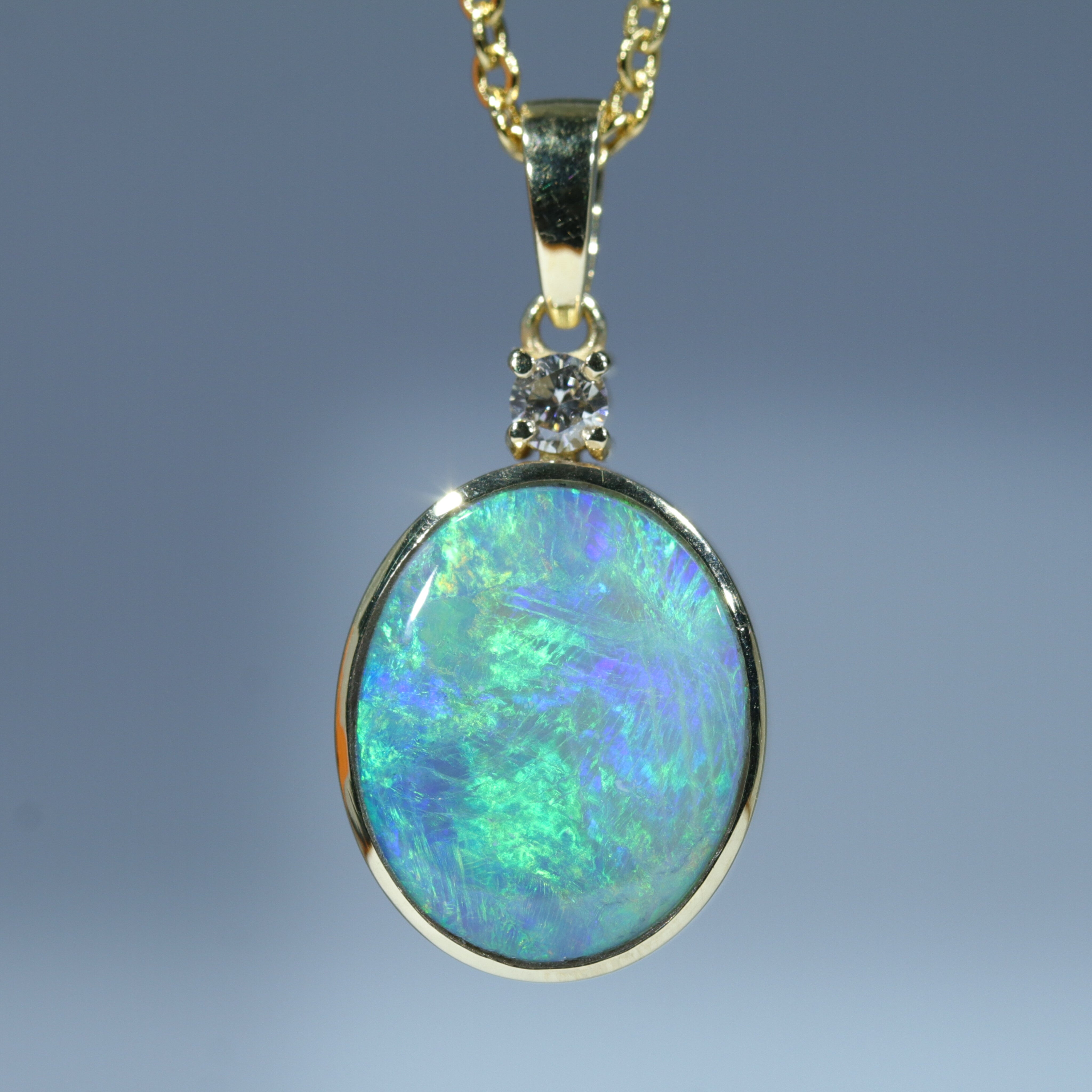 Gold store opal pendant